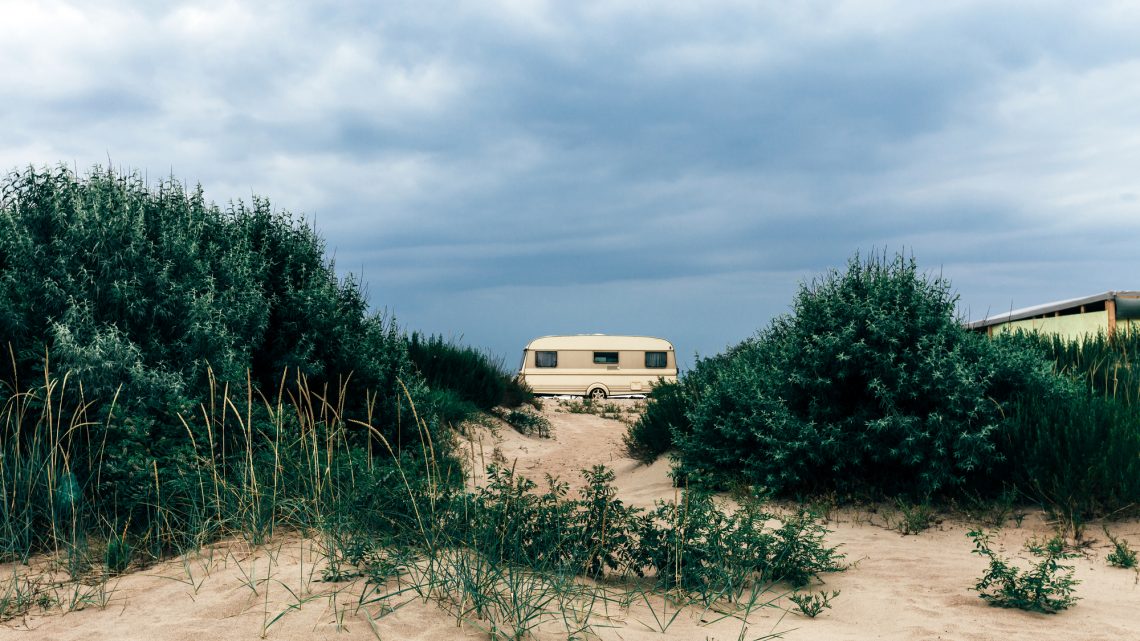Caravan trailer  On The Beach. Resting Tourism Vacation Concept