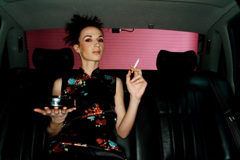 Woman smoking in car © Depositphotos