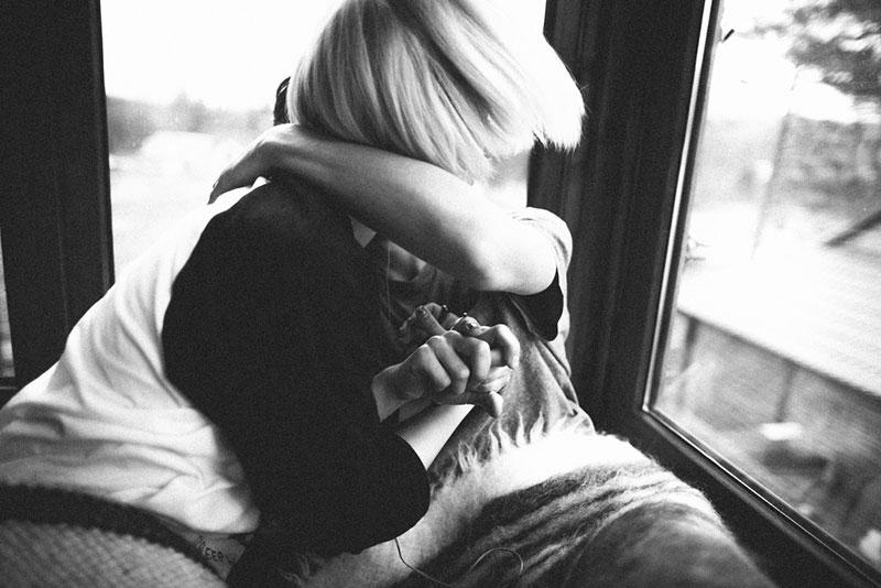 black and white picture of a couple hugging