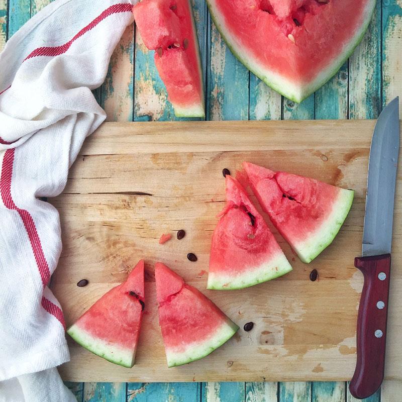 Slices of watermelon on board