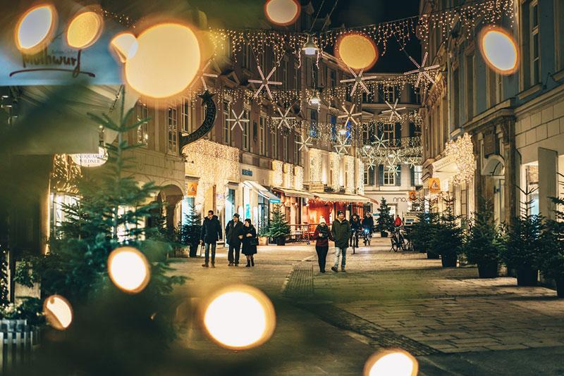 Graz, Austria - December 2017: Graz city streets advent Christmas decorations by night. Shot between Christmas lights.