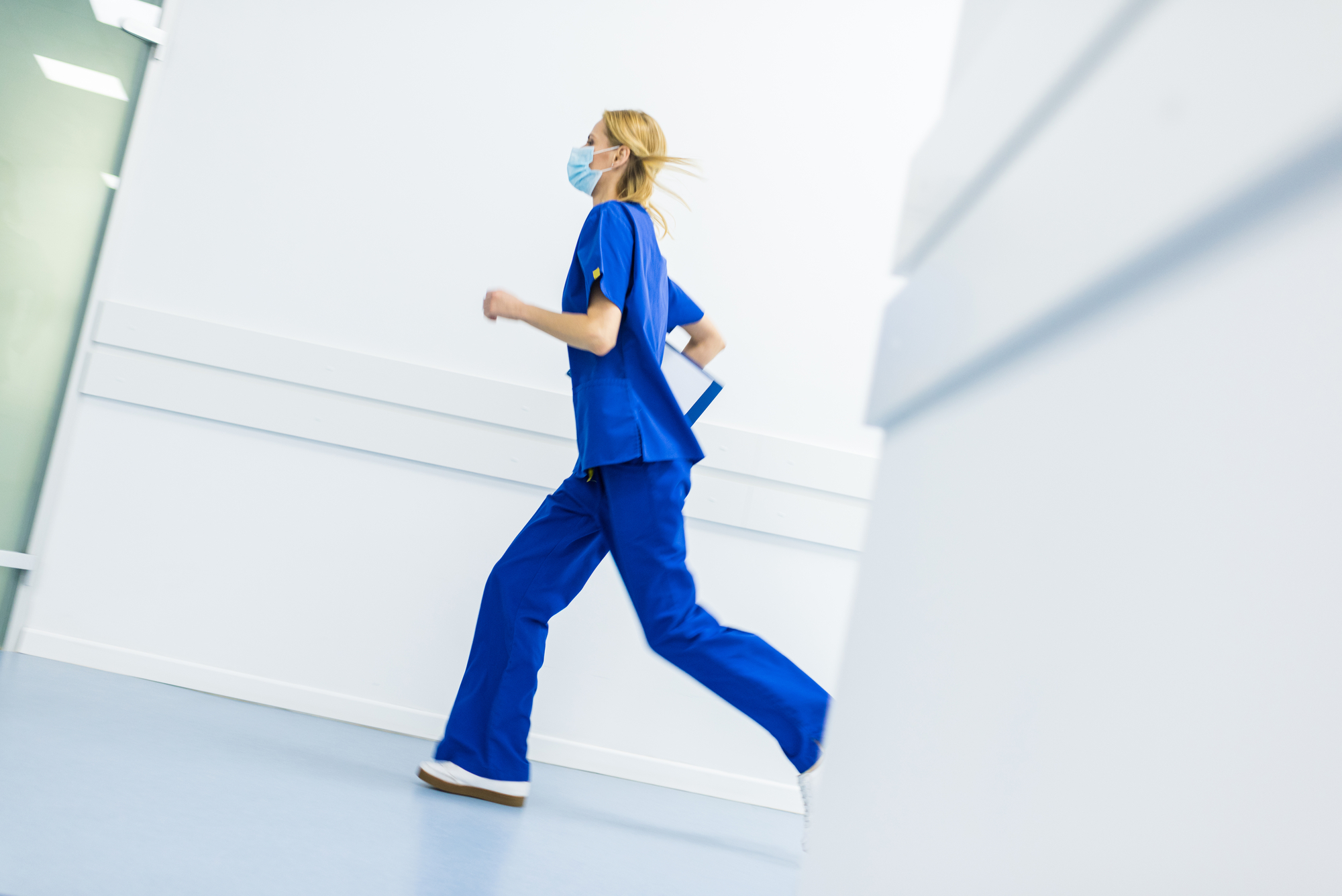 photo of running female doctor