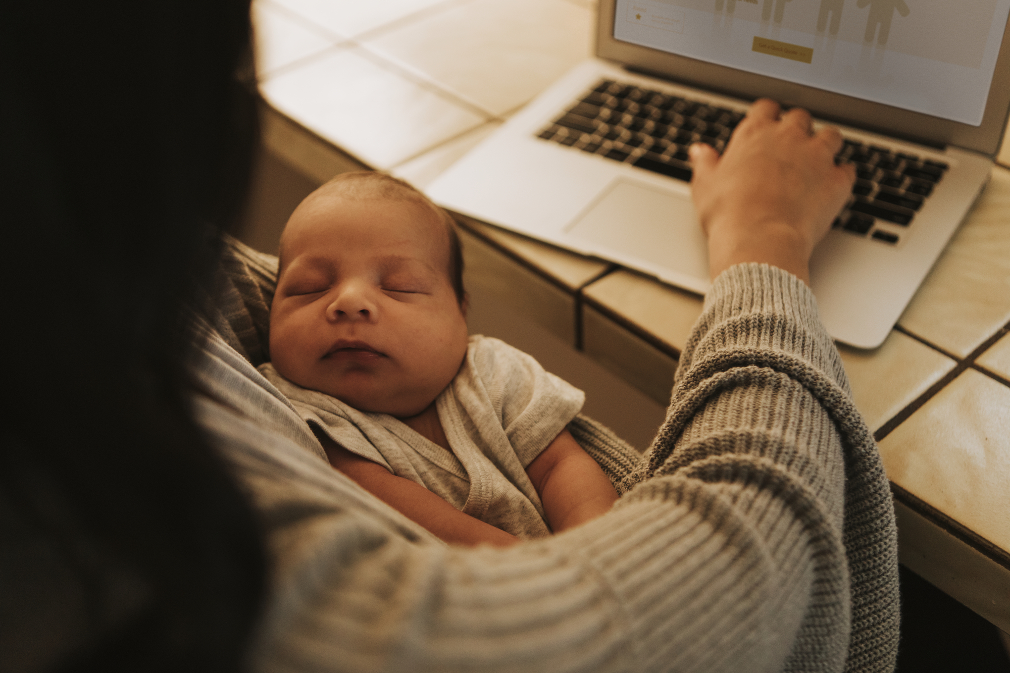 stock image of mother using a computer