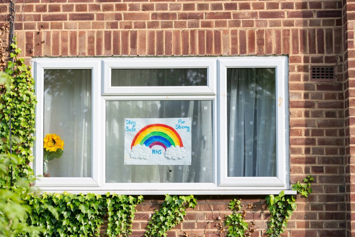 Children's drawing on house window with positive messages for the NHS workers during the COVID19 crisis