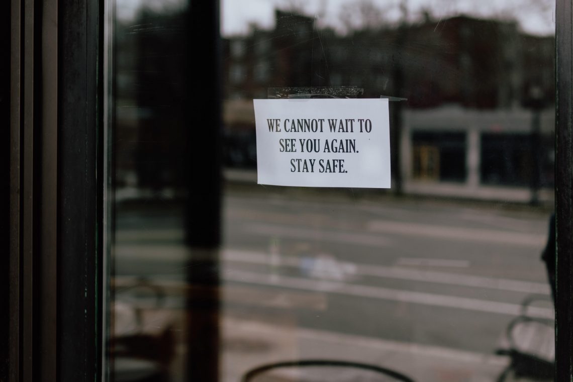 endearing sign on the door of a restaurant during the quarantine stock photo