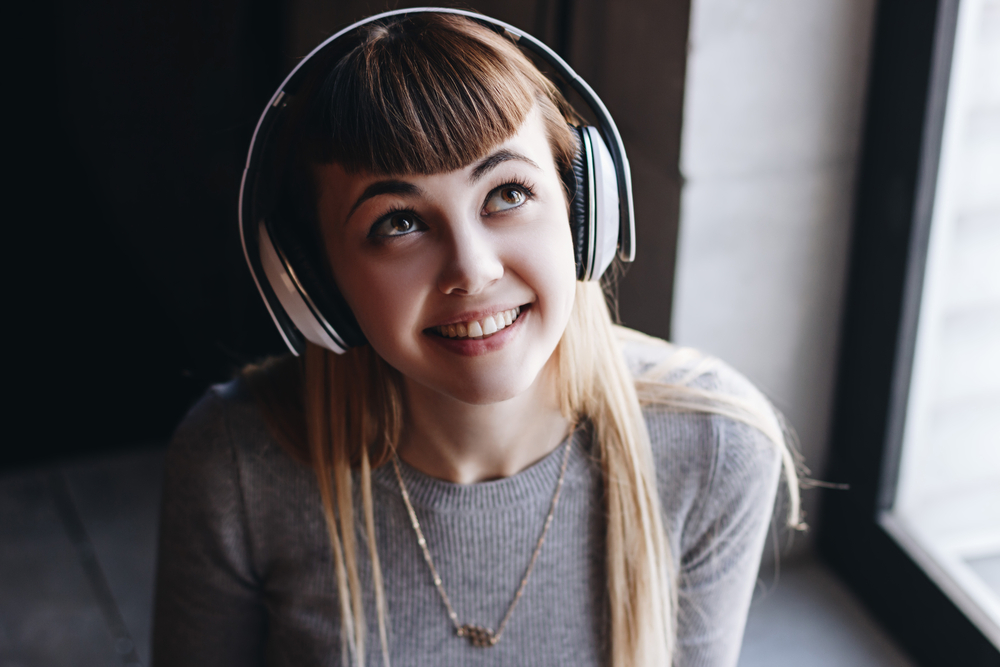 woman in headphones stock photography