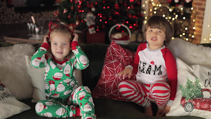 Children wearing Christmas pyjamas