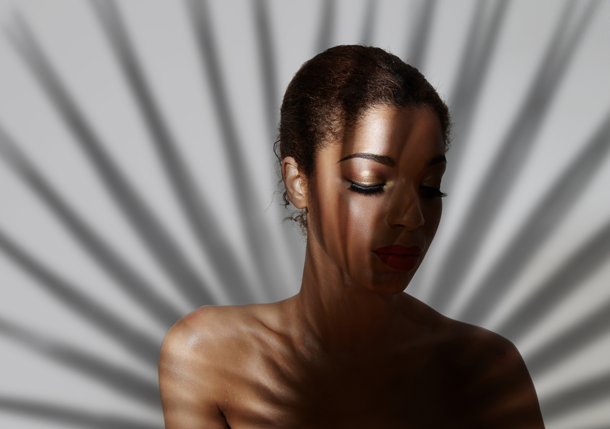 golden eyeshadow on a woman's fase - portrait photography ideas female
