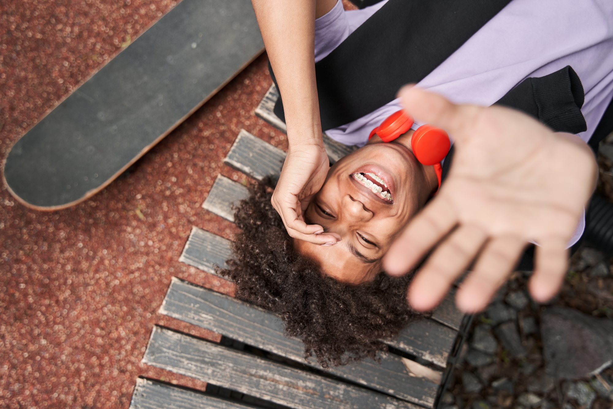 Top view of the overjoyed curly boy laughing out loud - stock photo