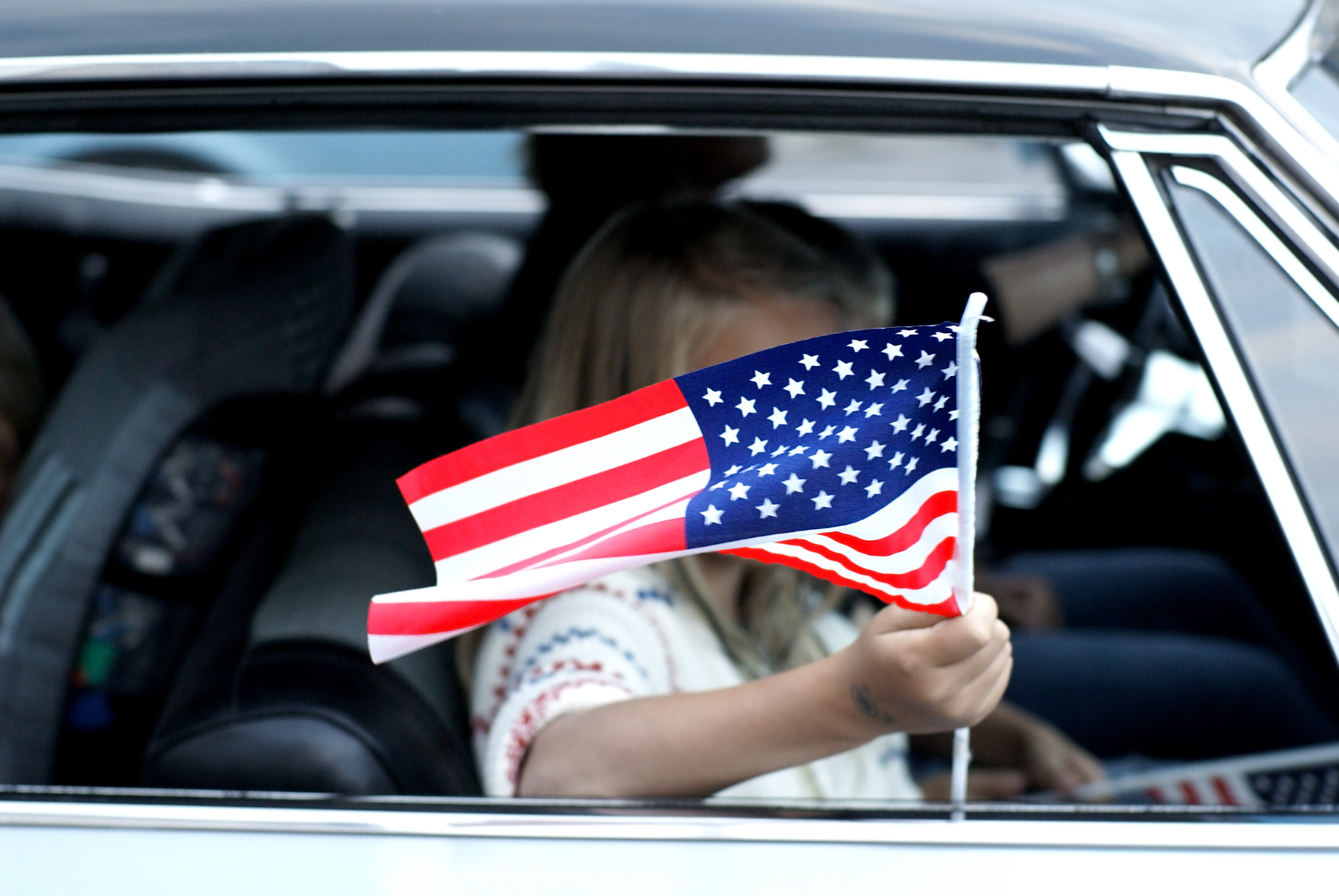 Child with American flag stock photo