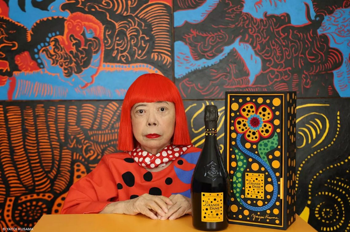 Yayoi Kusama with a Veuve Clicquot bottle of champagne