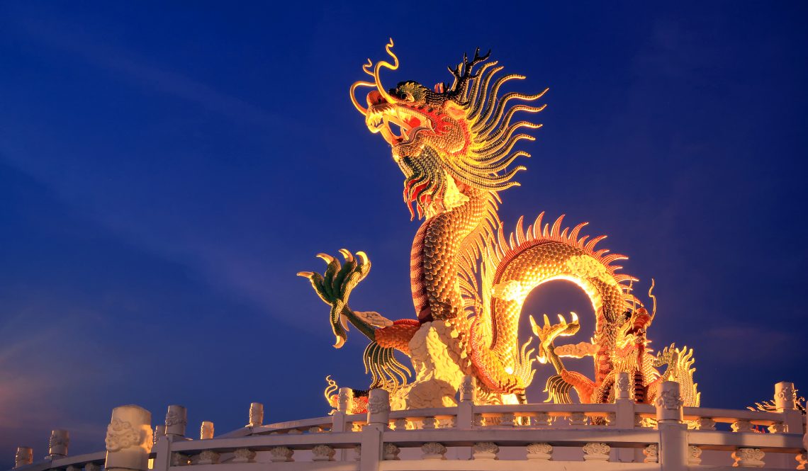 Chinese dragon statue at twilight time