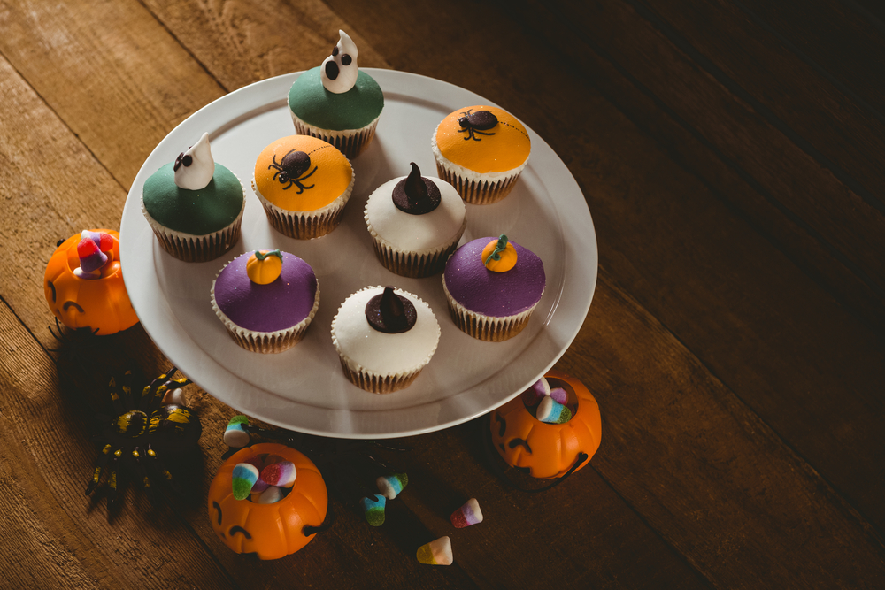 High angle view of cup cakes with decorations during Halloween