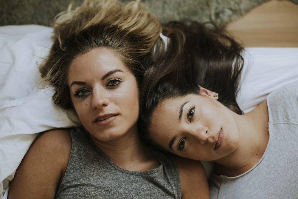 Lesbian couple together in bed