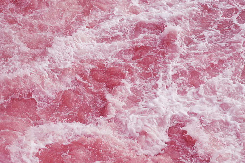 Фото абстрактний фон, рожева поверхня води