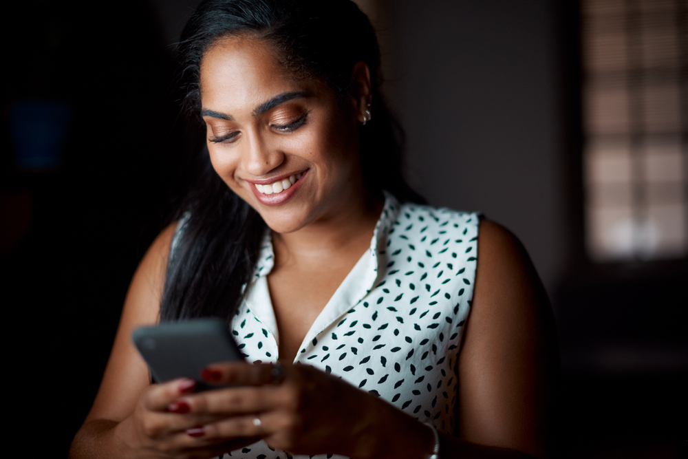 woman with a mobile phone smiling