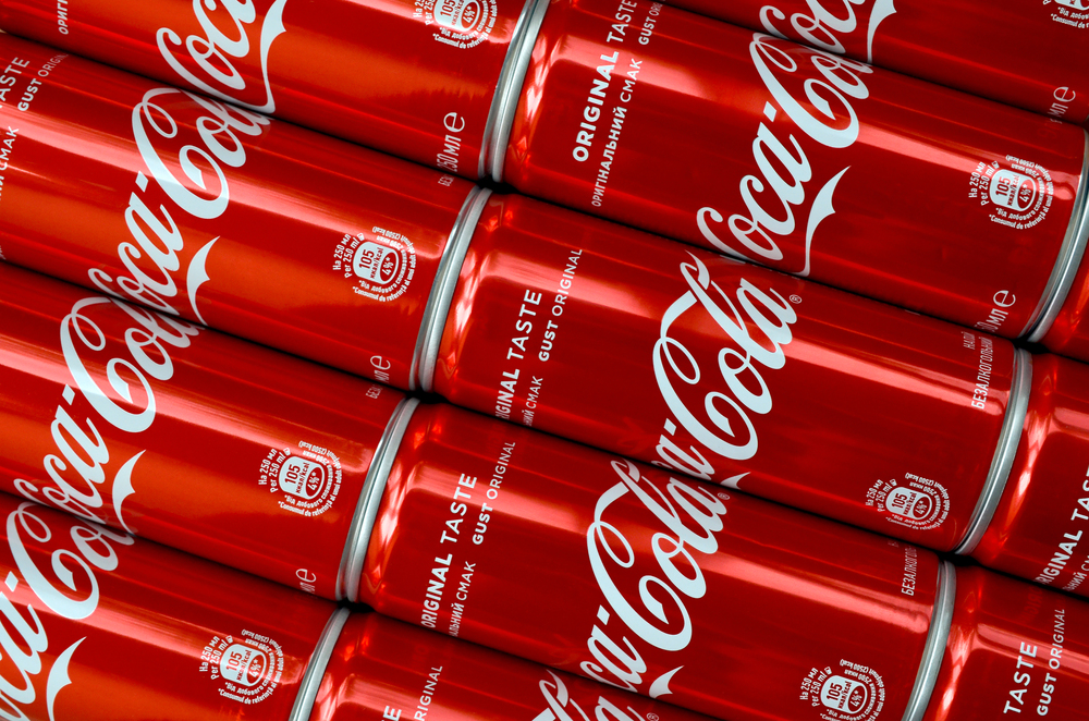 Photo Coca-Cola logo printed on aluminium tin cans close up 