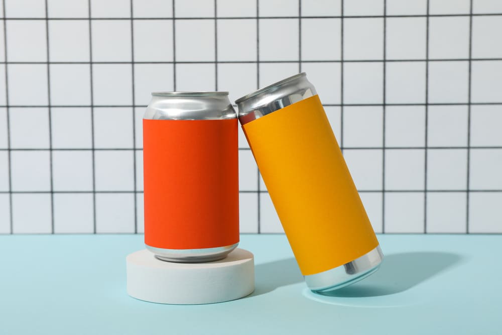 Tin cans on blue table on light background 